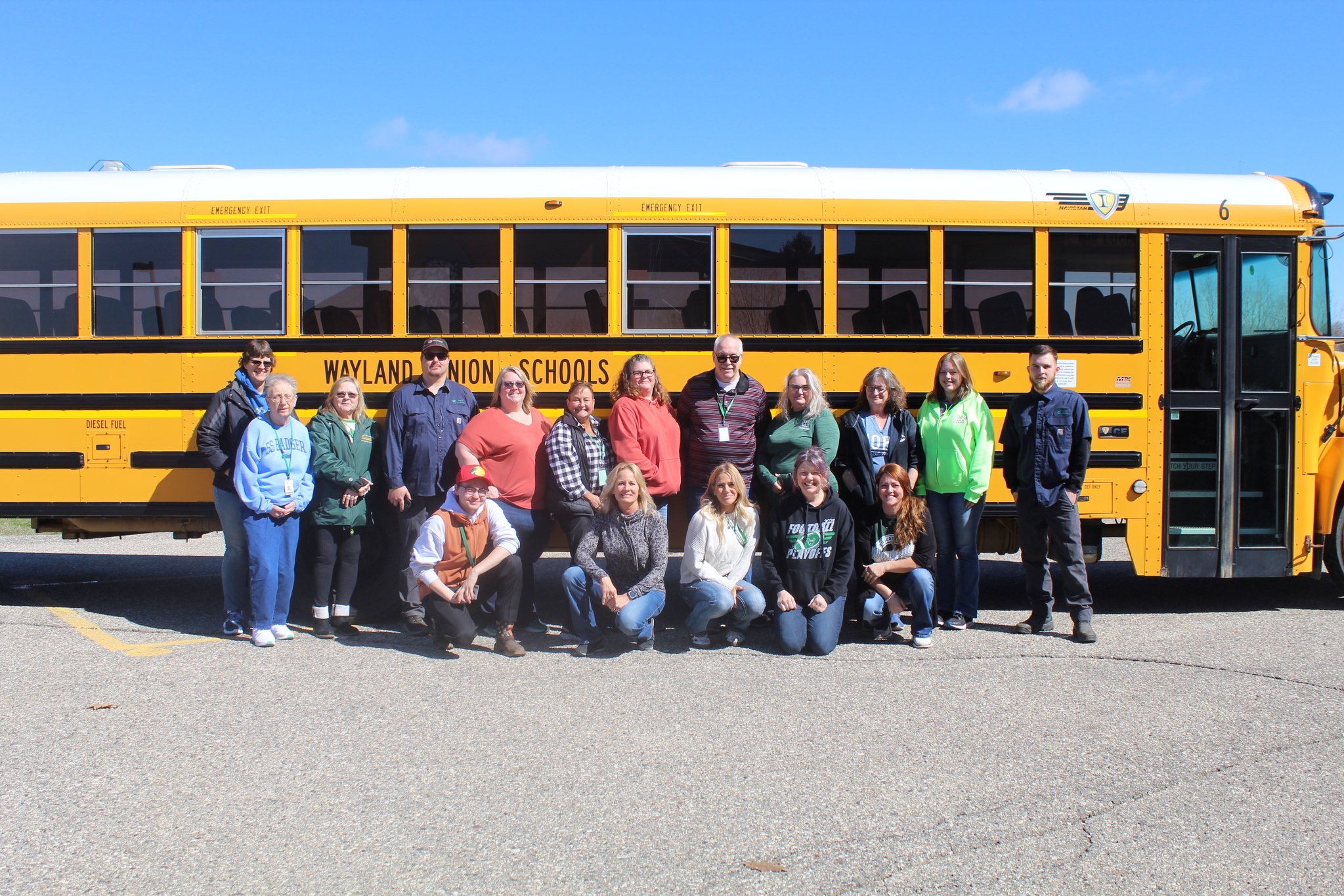 17 Bus Drivers in front of a Wayland Union School Bus